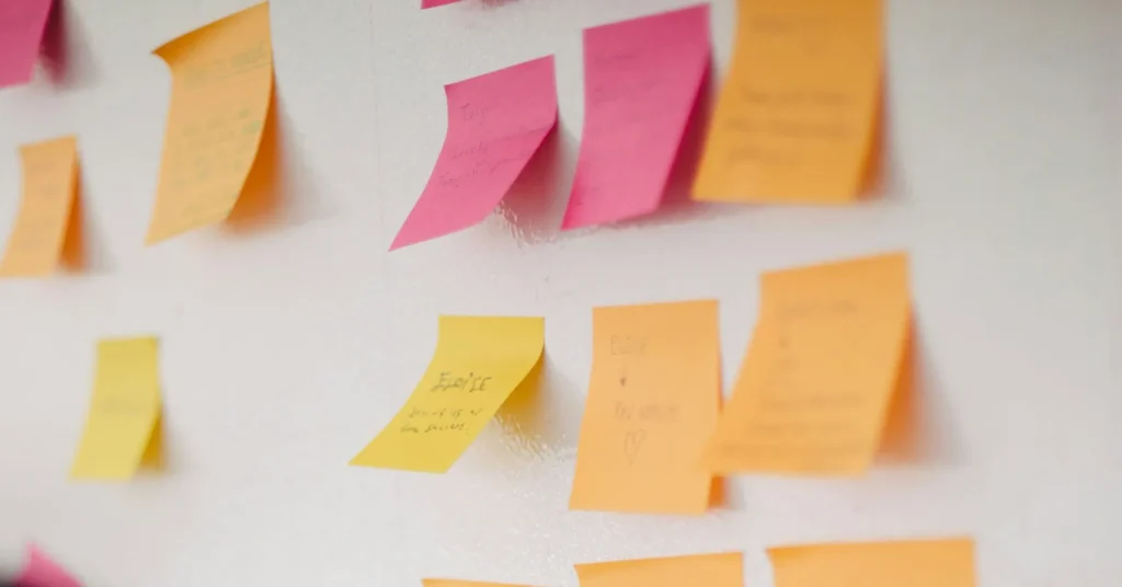 Post-its sticked on the wall during a brainstorm process for a UX project